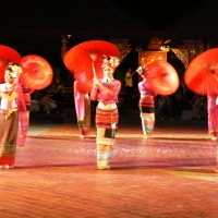 Umbrella dance at Khantoke Dinner and show.  www.chiangmaitourcenter.com