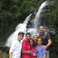 Family photo in front of the waterfall.