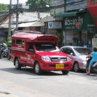 The local red taxi which could take you around Chiang Mai. www.chiangmaitourcenter.com